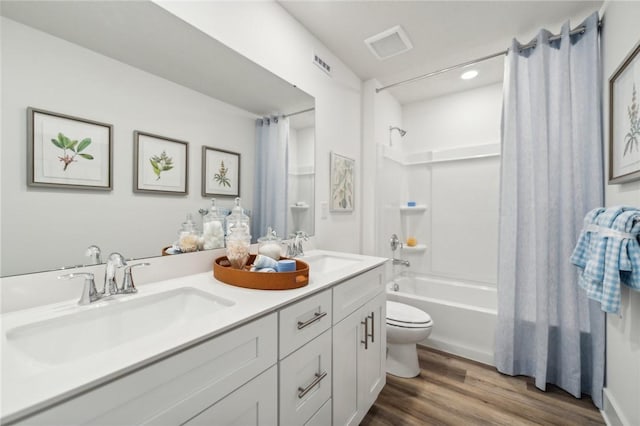 406 Barons Ct, Peters Twp, PA 15367 - bathroom with shower / bath combo with shower curtain, wood finished floors, toilet, double vanity, and recessed lighting