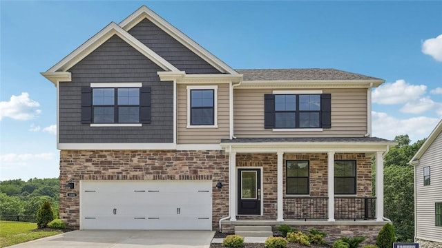 406 Barons Ct, Peters Twp, PA 15367 - craftsman inspired home with a porch, concrete driveway, stone siding, and a garage