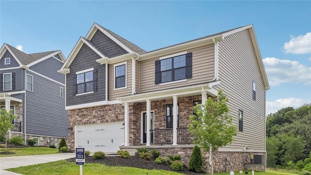 406 Barons Ct, Peters Twp, PA 15367 - craftsman-style house featuring stone siding, a porch, an attached garage, and concrete driveway