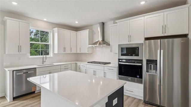 406 Barons Ct, Peters Twp, PA 15367 - kitchen featuring appliances with stainless steel finishes, wall chimney range hood, light wood finished floors, tasteful backsplash, and recessed lighting