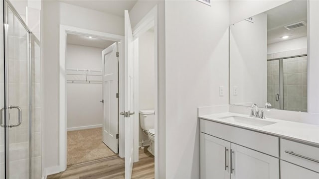 406 Barons Ct, Peters Twp, PA 15367 - bathroom with wood finished floors, a shower stall, vanity, and a spacious closet