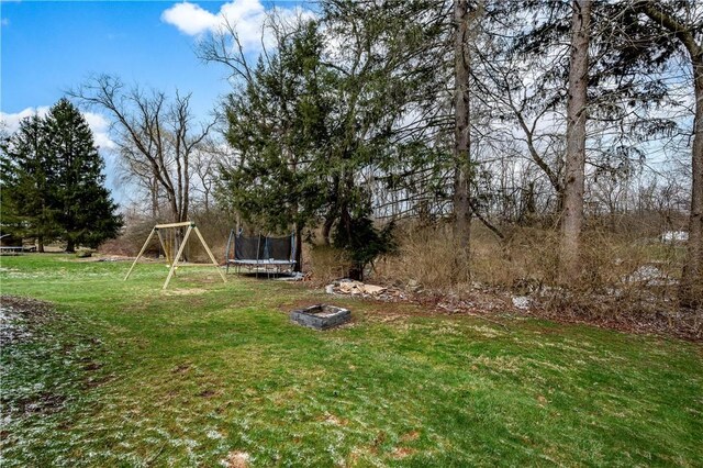 view of yard featuring a trampoline