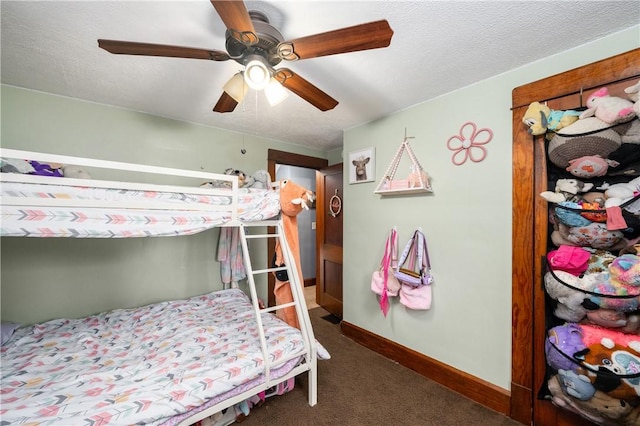 bedroom featuring baseboards, ceiling fan, and carpet