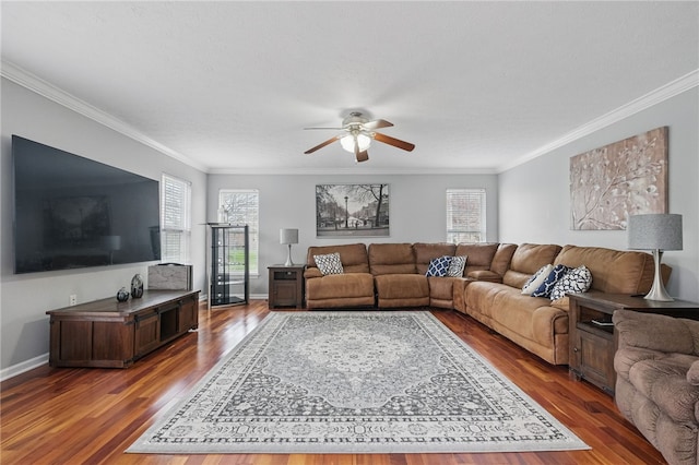 living room featuring crown molding, wood finished floors, ceiling fan, and baseboards