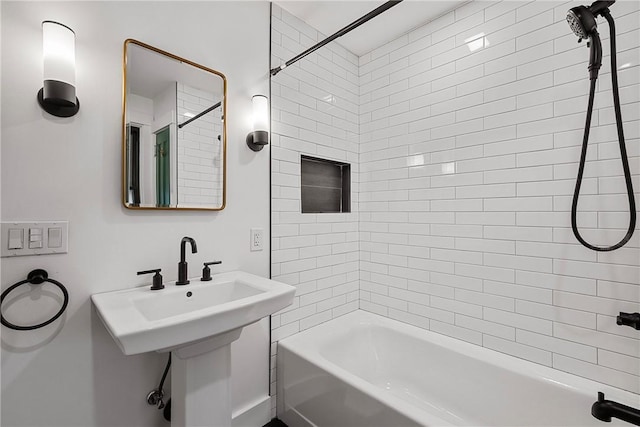 bathroom with a sink and tub / shower combination