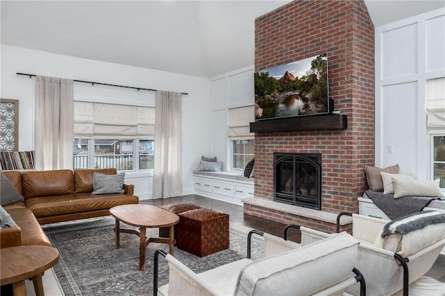 1371 Carnahan Rd, Banksville/Westwood, PA 15220 - living room featuring high vaulted ceiling, wood finished floors, and a brick fireplace