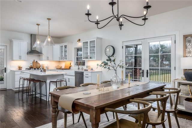 1371 Carnahan Rd, Banksville/Westwood, PA 15220 - dining area with french doors, an inviting chandelier, and dark wood finished floors