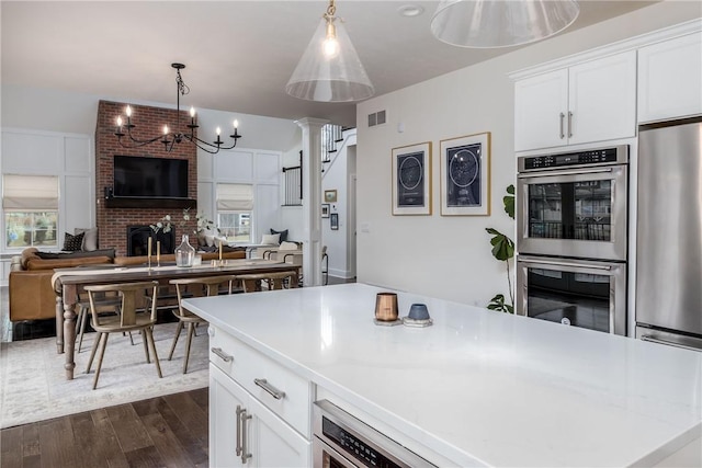 1371 Carnahan Rd, Banksville/Westwood, PA 15220 - kitchen featuring open floor plan, visible vents, dark wood-style flooring, and appliances with stainless steel finishes