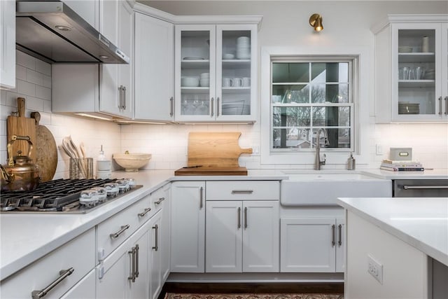 1371 Carnahan Rd, Banksville/Westwood, PA 15220 - kitchen featuring tasteful backsplash, white cabinets, a sink, wall chimney range hood, and stainless steel gas cooktop