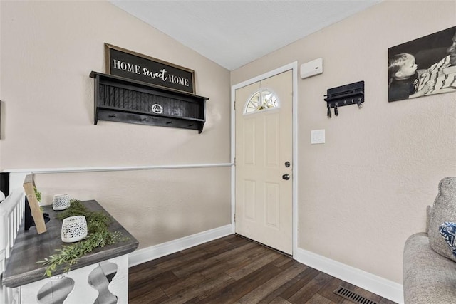 123 Summit Ridge Dr, South Fayette, PA 15017 - interior space featuring baseboards, dark wood finished floors, visible vents, and lofted ceiling