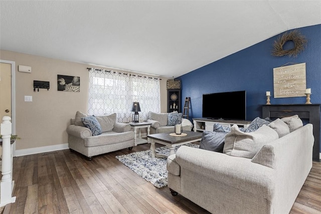 123 Summit Ridge Dr, South Fayette, PA 15017 - living room featuring baseboards, wood-type flooring, and vaulted ceiling