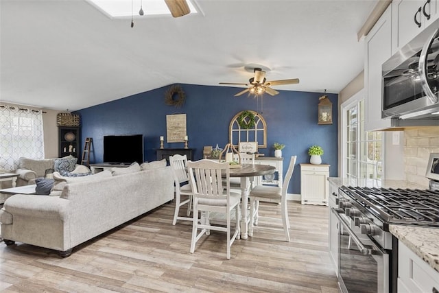 123 Summit Ridge Dr, South Fayette, PA 15017 - living area featuring light wood finished floors, a ceiling fan, and lofted ceiling
