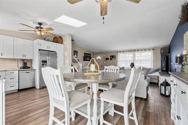 123 Summit Ridge Dr, South Fayette, PA 15017 - dining room featuring a ceiling fan, lofted ceiling with skylight, and wood finished floors