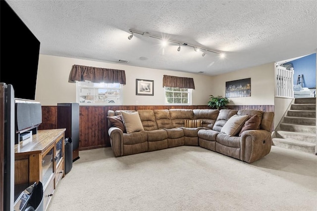 123 Summit Ridge Dr, South Fayette, PA 15017 - living area with rail lighting, visible vents, light carpet, and a textured ceiling