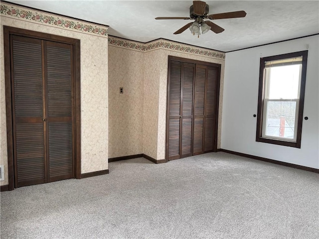 unfurnished bedroom with carpet and baseboards