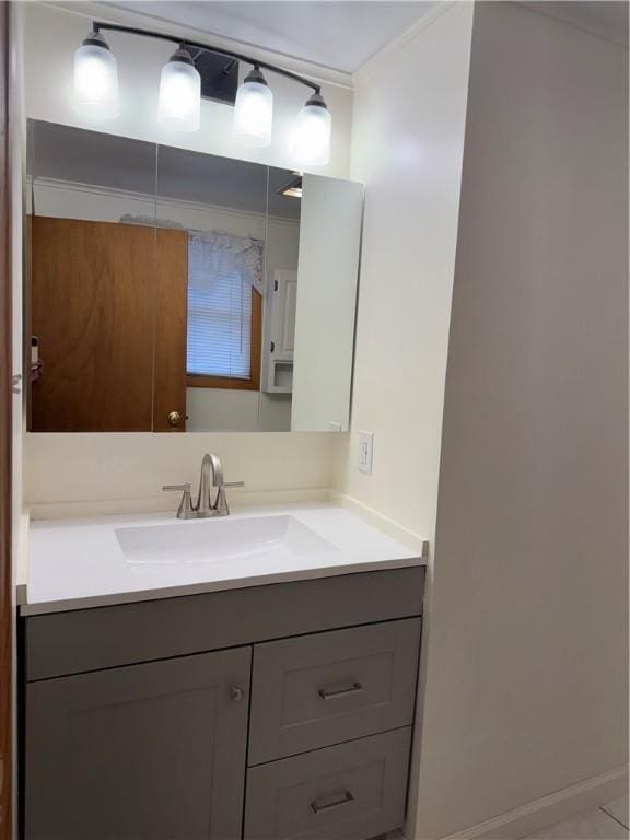bathroom with vanity and baseboards