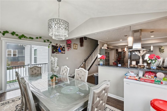 423 Labrador Ln, Jefferson Hills, PA 15025 - dining room featuring lofted ceiling, stairway, wood finished floors, baseboards, and a chandelier