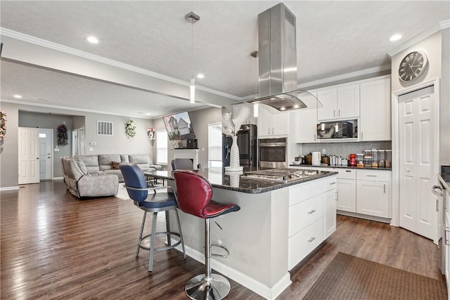 423 Labrador Ln, Jefferson Hills, PA 15025 - kitchen with island range hood, black microwave, oven, a kitchen bar, and a kitchen island