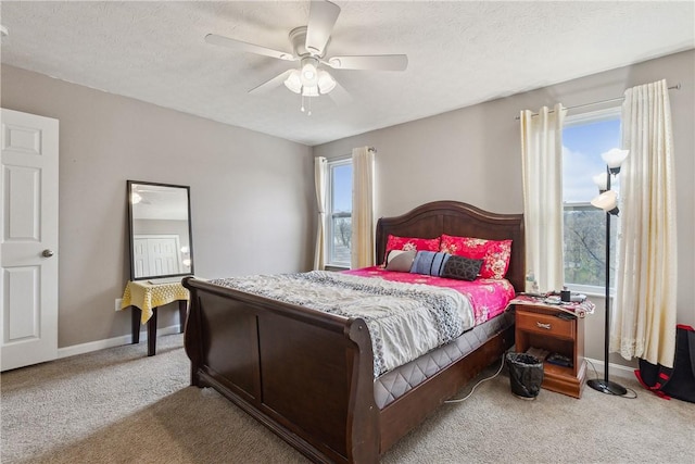 423 Labrador Ln, Jefferson Hills, PA 15025 - carpeted bedroom featuring baseboards, a ceiling fan, multiple windows, and a textured ceiling