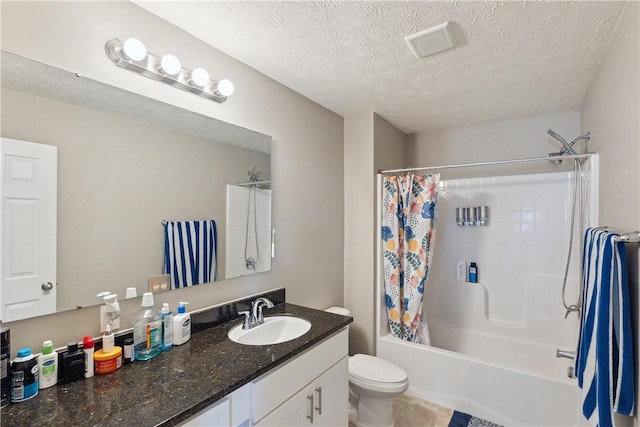 423 Labrador Ln, Jefferson Hills, PA 15025 - full bath with visible vents, toilet, vanity, a textured ceiling, and shower / bath combo