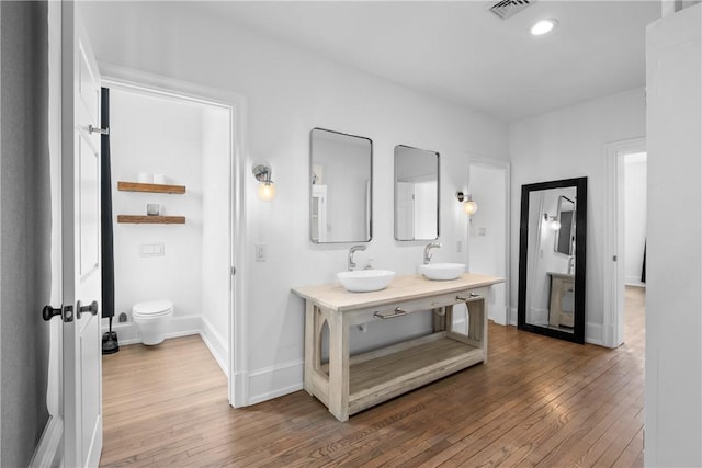 4721 Stanton Ave, Stanton Heights, PA 15201 - full bathroom featuring hardwood / wood-style floors, a sink, and visible vents