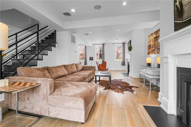 4721 Stanton Ave, Stanton Heights, PA 15201 - living room with stairway, a fireplace with flush hearth, visible vents, and hardwood / wood-style floors