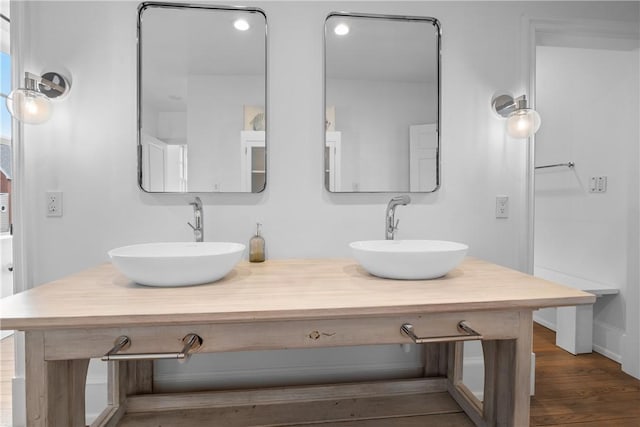 4721 Stanton Ave, Stanton Heights, PA 15201 - bathroom featuring a sink, double vanity, and wood finished floors