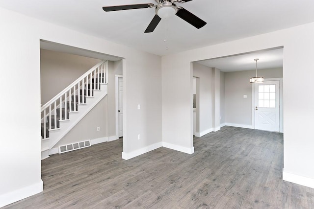 2017 Leishman, Arnold, PA 15068 - empty room featuring visible vents, baseboards, a ceiling fan, stairway, and wood finished floors