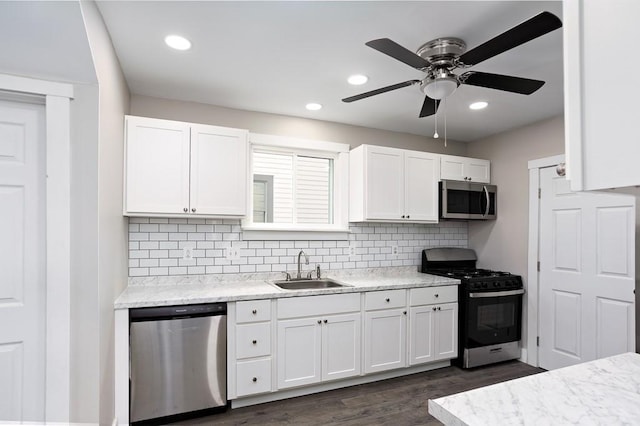 2017 Leishman, Arnold, PA 15068 - kitchen featuring a ceiling fan, white cabinets, a sink, stainless steel appliances, and decorative backsplash