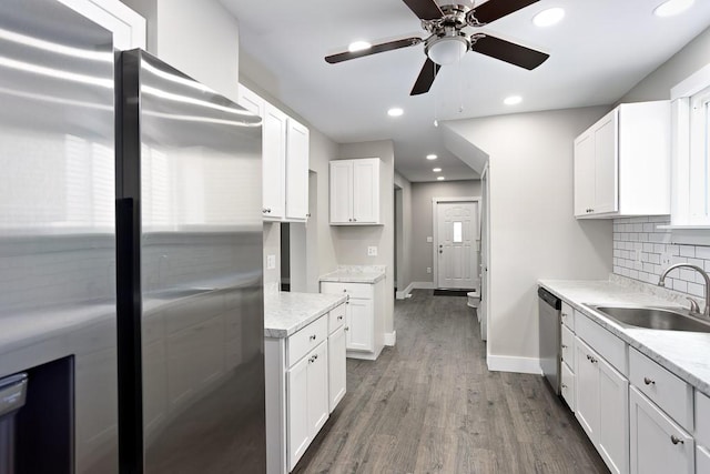 2017 Leishman, Arnold, PA 15068 - kitchen featuring baseboards, a sink, ceiling fan, appliances with stainless steel finishes, and decorative backsplash