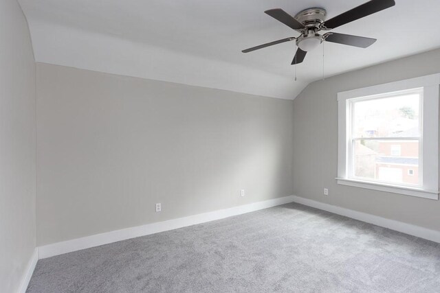 2017 Leishman, Arnold, PA 15068 - unfurnished room featuring baseboards, a ceiling fan, vaulted ceiling, and light carpet
