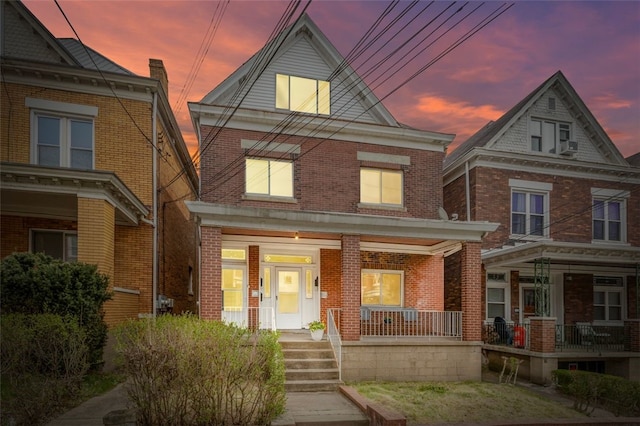 826 Collins Ave, Highland Park, PA 15206 - view of front of property featuring brick siding and a porch