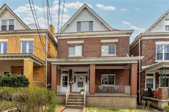 826 Collins Ave, Highland Park, PA 15206 - view of front facade featuring a porch and brick siding