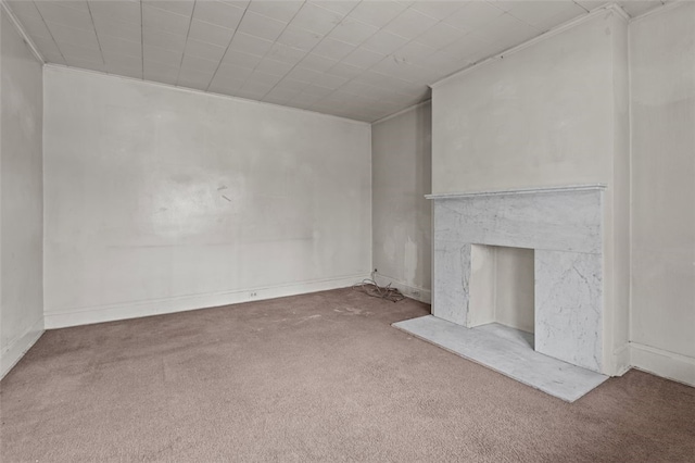826 Collins Ave, Highland Park, PA 15206 - unfurnished living room featuring baseboards, a fireplace, ornamental molding, and carpet