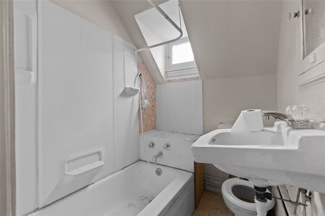 826 Collins Ave, Highland Park, PA 15206 - bathroom with tile patterned floors, bathtub / shower combination, vaulted ceiling, and toilet