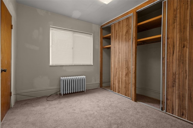 826 Collins Ave, Highland Park, PA 15206 - unfurnished bedroom featuring a closet, radiator, and carpet