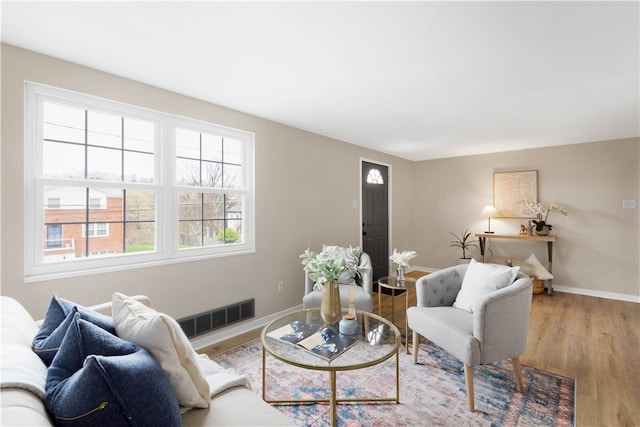 2011 Woodward Ave, Brookline, PA 15226 - living area with visible vents, baseboards, and wood finished floors
