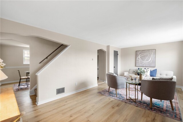 2011 Woodward Ave, Brookline, PA 15226 - living room with stairs, visible vents, baseboards, and wood finished floors