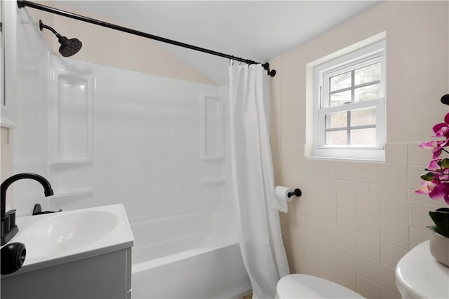 2011 Woodward Ave, Brookline, PA 15226 - full bathroom featuring shower / tub combo, vanity, tile walls, and toilet