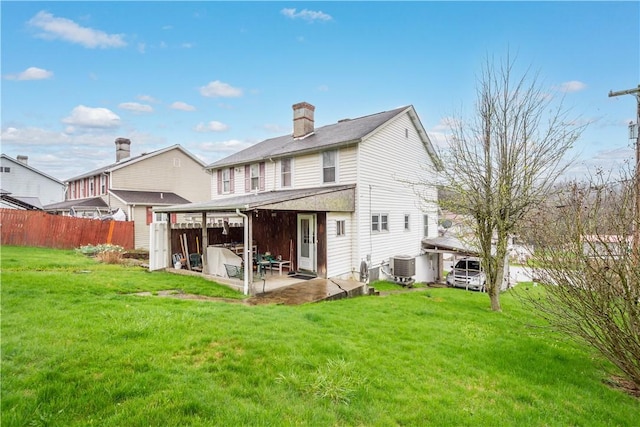 16 Fishpot Rd, Centerville, PA 15368 - rear view of property with central air condition unit, a patio area, fence, and a lawn