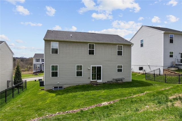 106 Morgan Dr, South Strabane, PA 15301 - back of property with a lawn, a fenced backyard, and entry steps