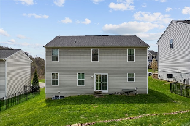 106 Morgan Dr, South Strabane, PA 15301 - rear view of property with entry steps, a lawn, a fenced backyard, and roof with shingles