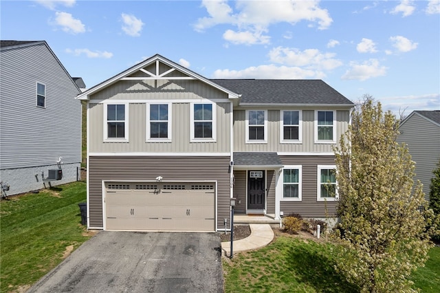 106 Morgan Dr, South Strabane, PA 15301 - craftsman house featuring board and batten siding, a shingled roof, driveway, and a front yard