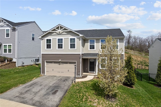 106 Morgan Dr, South Strabane, PA 15301 - craftsman-style home with a front lawn, driveway, fence, and board and batten siding