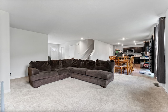 106 Morgan Dr, South Strabane, PA 15301 - living room featuring recessed lighting, stairway, visible vents, light carpet, and baseboards