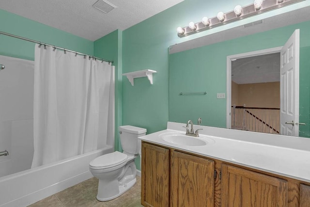 bathroom with toilet, vanity, shower / bathtub combination with curtain, tile patterned floors, and a textured ceiling