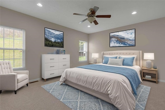 bedroom featuring light colored carpet, baseboards, recessed lighting, and ceiling fan
