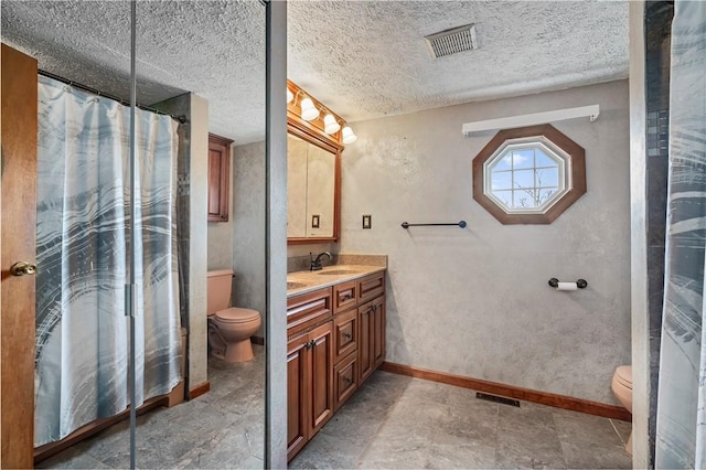 full bathroom featuring toilet, visible vents, and baseboards