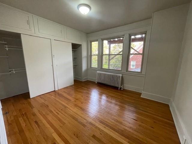6605 Woodwell St, Squirrel Hill, PA 15217 - unfurnished bedroom with radiator heating unit, baseboards, and wood finished floors