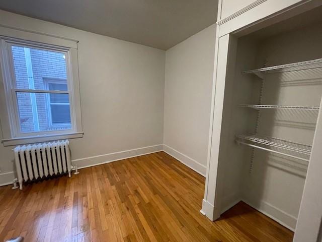 6605 Woodwell St, Squirrel Hill, PA 15217 - interior space with radiator, hardwood / wood-style floors, a closet, and baseboards